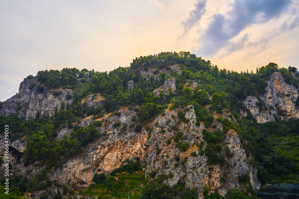 Naklejka premium Mountain Forest, Cliffside, Sunset Sky