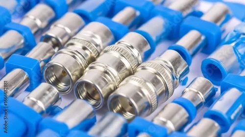 Coaxial Cable Connectors: Close-Up of Blue and Silver F-Connectors