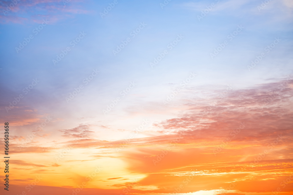 Obraz premium Beautiful , luxury soft gradient orange gold clouds and sunlight on the blue sky perfect for the background, take in evening,Twilight, Large size, high definition landscape photo