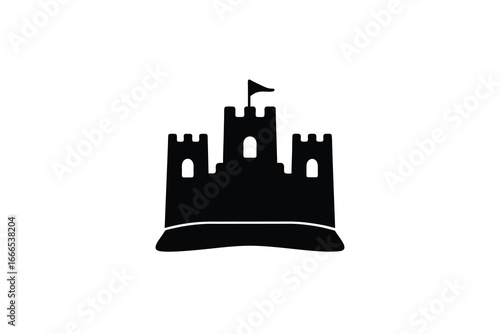 A black silhouette of a castle with a flag on a sandy base