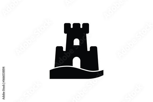 A black silhouette of a sand castle on a beach with a tower