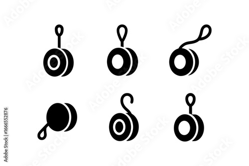 Set of black yo-yo silhouettes on white background
