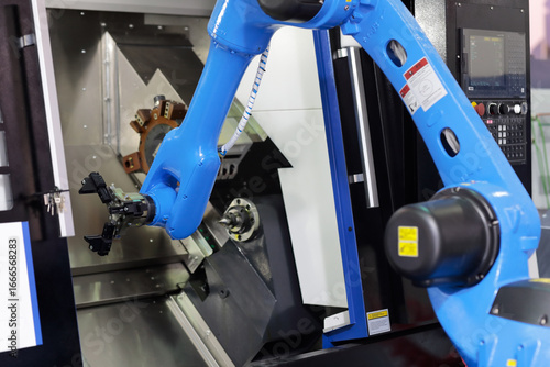 Fotografie CNC lathe machine with collaborative robot
