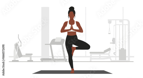 African American Woman Practicing Yoga Tree Pose in a Modern Gym for Health and Mindful Wellness