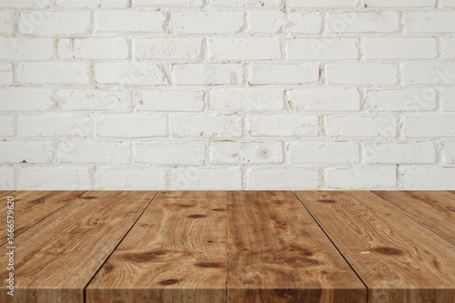 Blank natural wood tabletop with vintage white brick backdrop for showcasing products