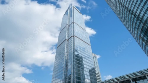 Modern Skyscraper with Blue Sky and Clouds 4k video