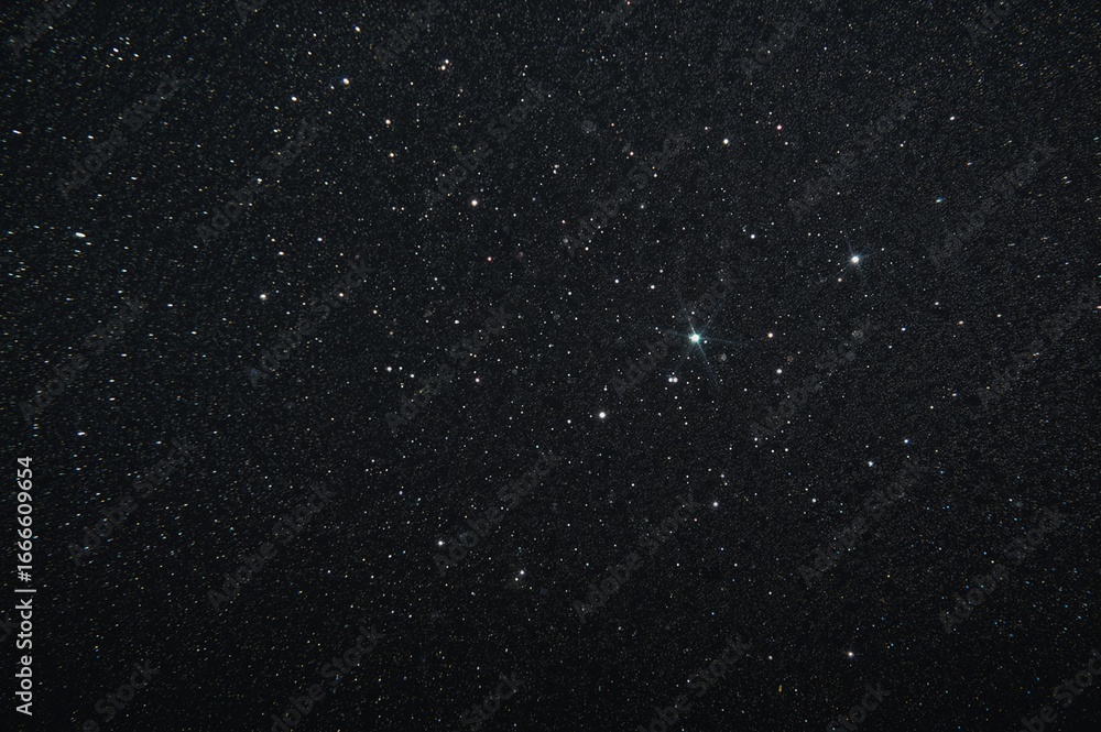 Fototapeta premium Showcasing radiant specks with a continuous pattern on a dark gray surface