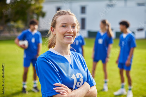 Wallpaper Mural Young athlete girl smiling at football field Torontodigital.ca