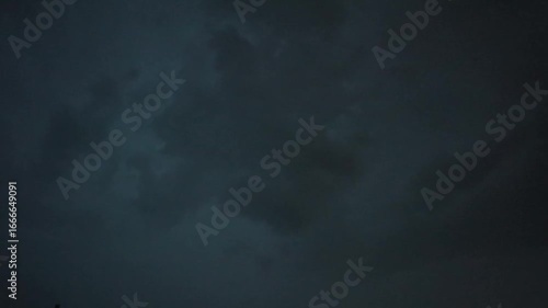 Lightning in the sky during rain in nature