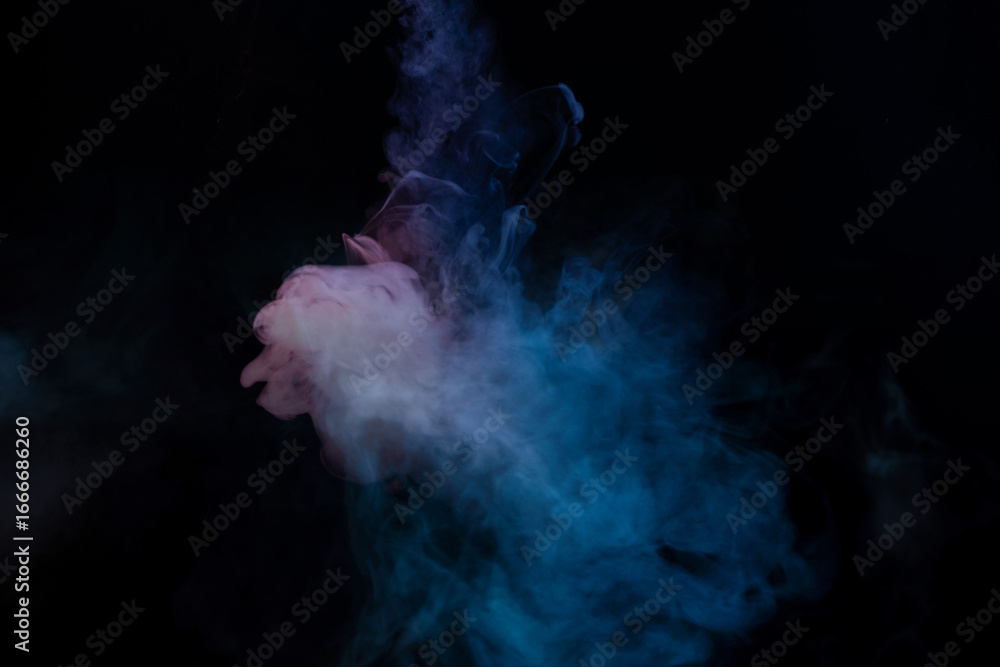 Obraz premium Blue and yellow steam on a black background.