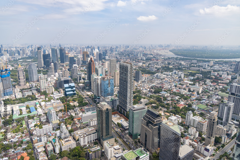 Fototapeta premium Thailand, Bangkok. November 11, 2024. Aerial panorama of Bangkok skyline showing tall skyscrapers, business district and Chao Phraya river in background