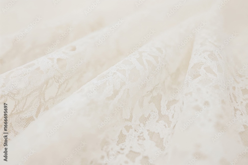 Obraz premium Delicate white lace with a soft blur effect, featuring an intricate mesh pattern that offers a light and elegant texture, perfect for vintage-style creations.