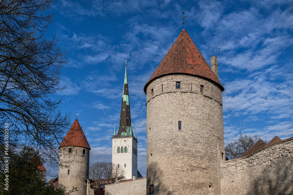 Obraz premium Towers of City Wall And St Olaf Church in Tallinn, Estonia