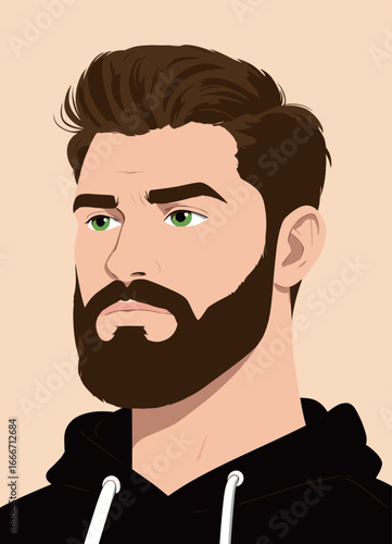 Portrait of a handsome man with a beard in a black hoodie