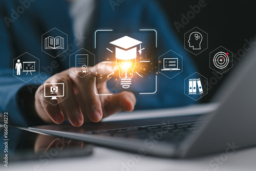 Quadro su tela A person using laptop and smartphone with virtual education icons