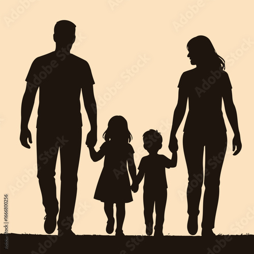 Family of four walking together at sunset silhouette against a colorful sky