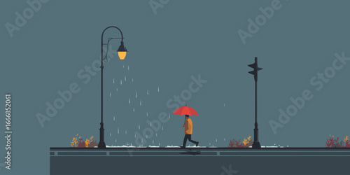 A person in a yellow jacket holding a red umbrella walks in the rain under a glowing streetlamp.