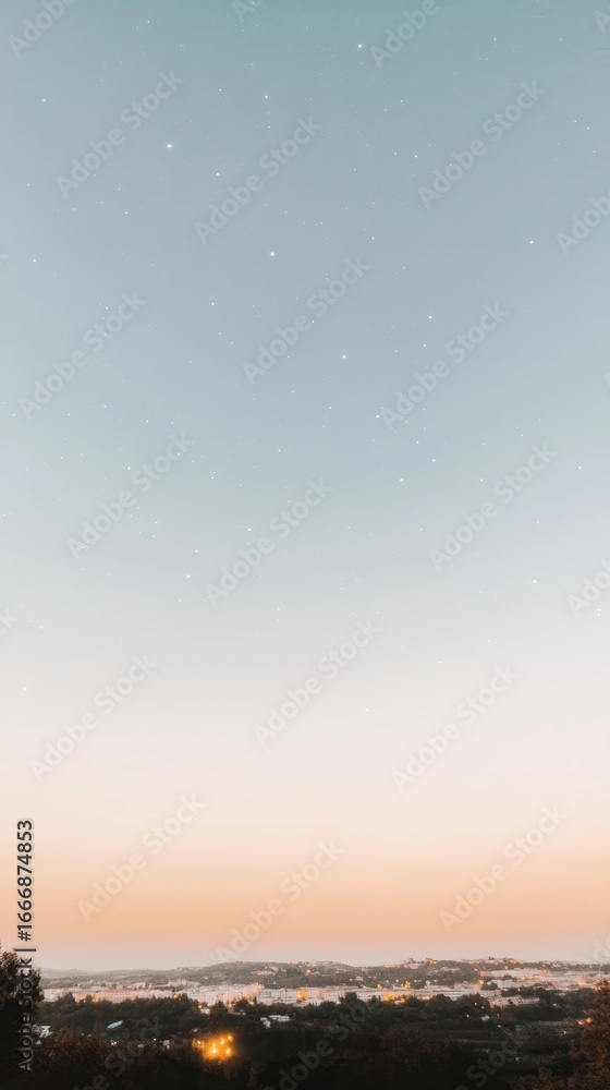 Obraz premium Serene twilight sky over a tranquil town, stars beginning to appear