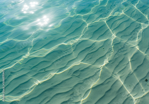 Blue water surface with turquoise waves and clear tropical texture