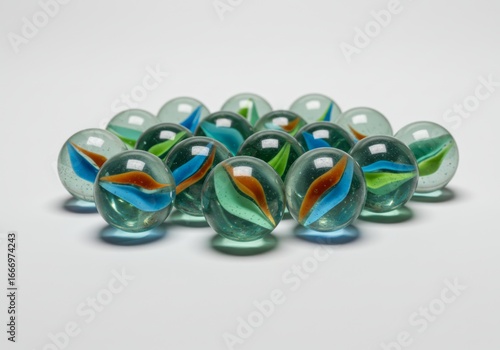 Group of vibrant marble spheres with colorful swirls on a white backdrop