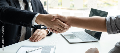 Good deal of interview, Business people and recruiter shaking hands greeting or get acquainted of conducting a job interview while sitting at the working meeting in office