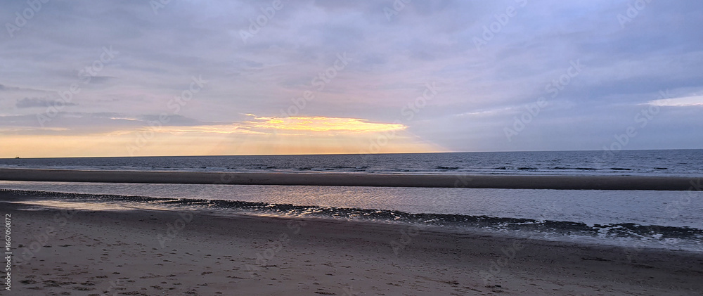 Fototapeta premium Vacation by the sea at sunset. Sea, sky, sand on the beach.