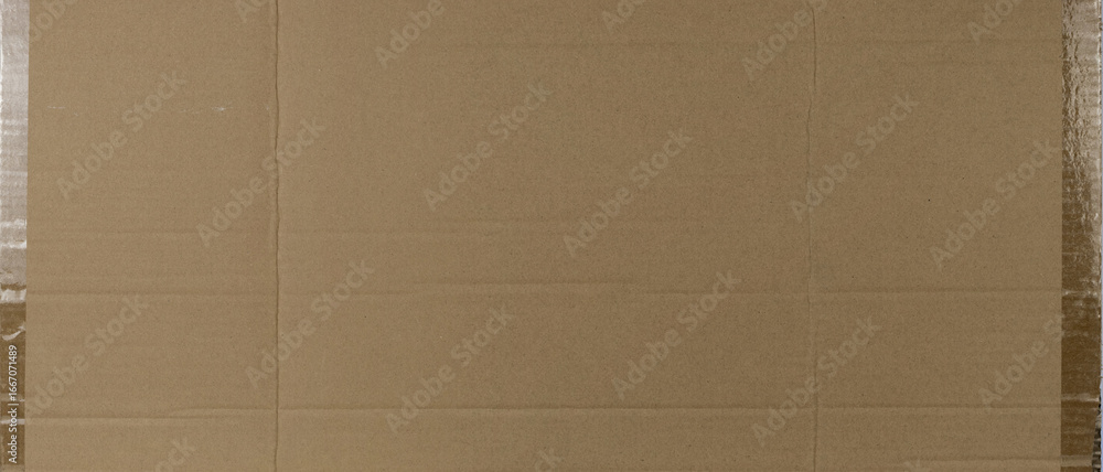 Fototapeta premium Close-up texture of smooth brown recycled cardboard surface