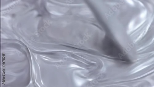 Smooth, flowing, light gray fabric drapes