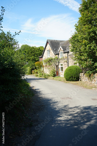 Dale Abbey, Derbyshire, England – August 25 2025: Stone cottage on a quiet country lane in summer light