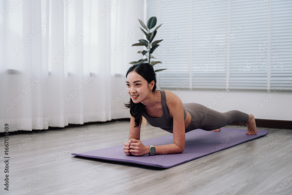 Woman Performing Plank Exercise at Home Woman Performing Plank Exercise at Home