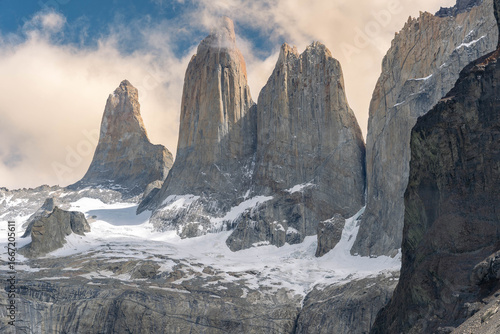 Bild auf Leinwand The iconic granite towers of Torres del Paine National Park in Patagonia, Chile, rising above a serene turquoise glacial lake on a clear day