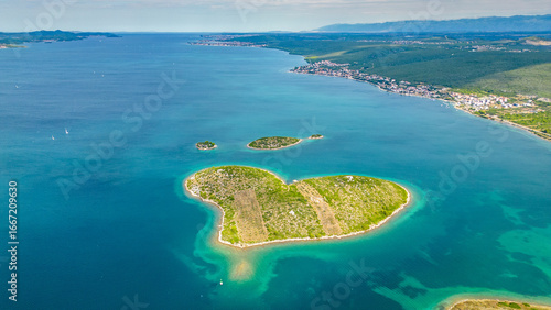 Aerial view of Galešnjak, the famous heart-shaped island located near Sveti Filip i Jakov in the Adriatic Sea, Croatia. Known as the “Island of Love,” it is one of the world’s most romantic natural