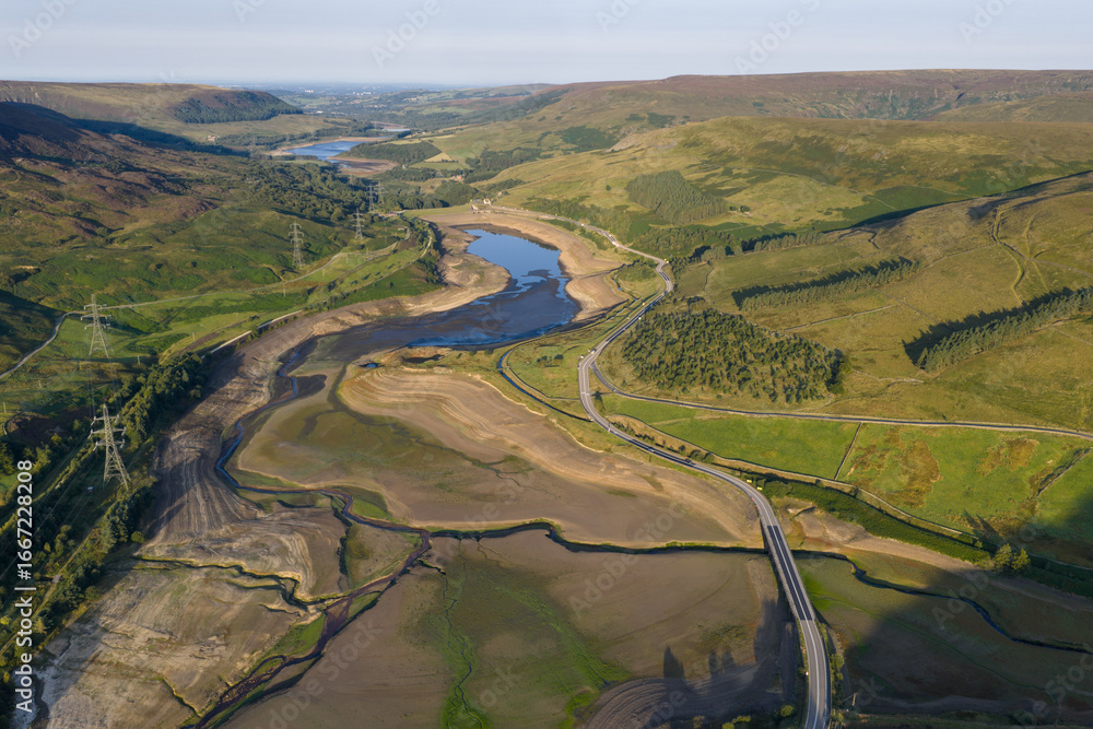 Naklejka premium Aerial View of Dried Landscape Surrounding a Reservoir in the Countryside