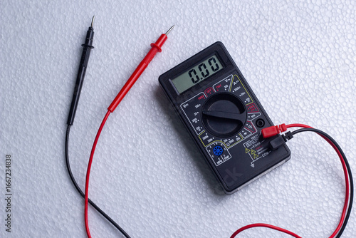 Foto Digital multimeter on white background