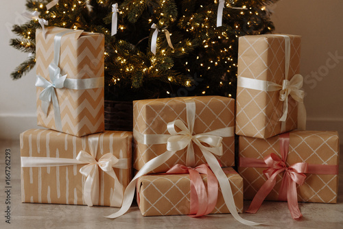 Wallpaper Mural A bunch of beautiful gifts lies under the Christmas tree decorated with snowflakes and golden balls. Warm, cozy and beautiful modern New Year's room design. Torontodigital.ca