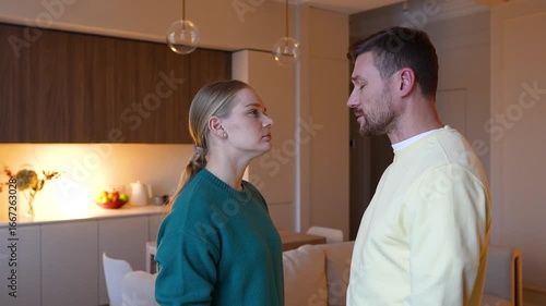 Dissatisfied wife does not believe deceitful husband, depressed by betrayal. Rejection, couple turmoil, trust shattered, relationship breakdown, betrayal, irreparable damage, heartbreak