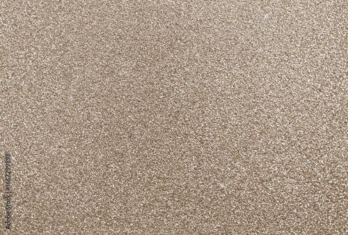 Gold glitter background, shiny sparkling champagne colored glitter particles creating textured metallic effect for website, marketing and social media, abstract sparkles, golden beige shimmer sequins