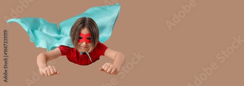 Little boy dressed as super...