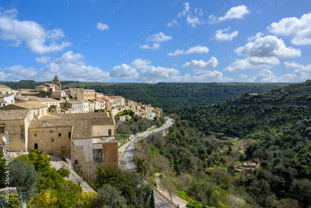 Obraz premium View of Ragusa Ibla and Via Avvocato Giovanni Ottaviano Road, a hill town in Sicily that lies below the Hyblaean Mountains