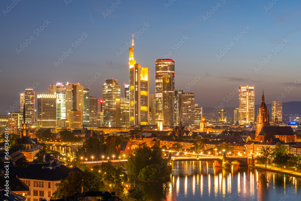Obraz premium Illuminated Frankfurt Downtown Skyscrapers, Residential Buildings, Bridges and Main River at Night. Aerial View. Blue Hour. Hesse, Germany