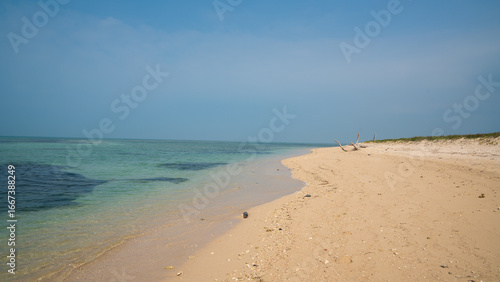 Isla de Enmedio, Veracruz. Pristine sandy beach and turquoise sea under clear blue sky in Mexico.