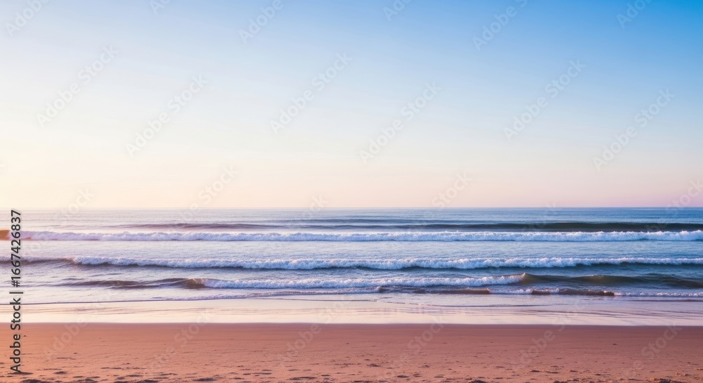Obraz premium Serene Coastal Scene: Gentle Waves Rolling onto Sandy Beach at Sunset
