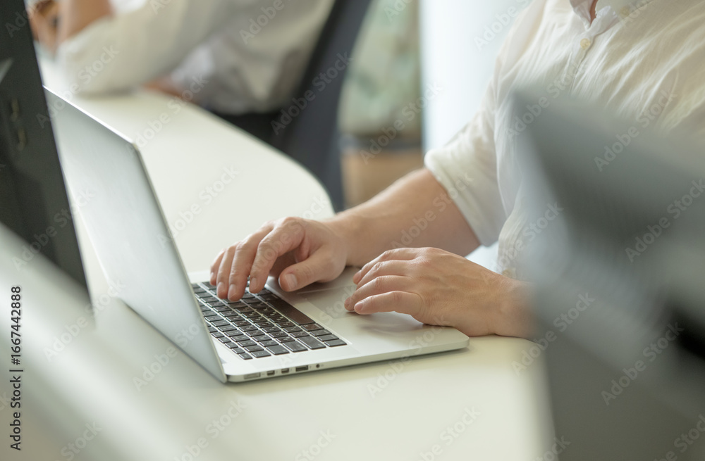 Fototapeta premium male hands with laptop in office