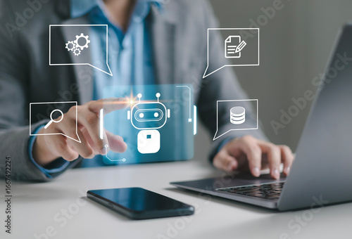 Businessman using laptop to control AI at desk in office. Artificial intelligence is analyzing data and generating reports. Artificial intelligence and intelligent automation (IA) technology.