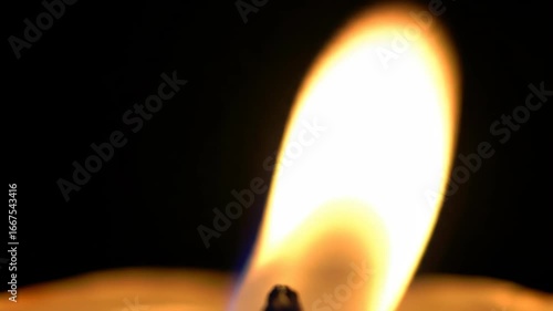 Wallpaper Mural Close up of a bright candle flame against dark background Torontodigital.ca