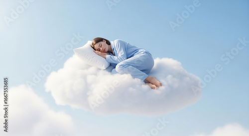 Woman sleeping on cloud in blue sky