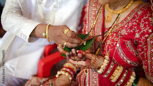 Ceremony of Wearing Turmeric Thread on hand of bride. Marathi Wedding Ceremony. Maharashtra Culture. Hindu wedding rituals and ceremony