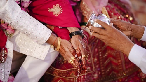 Ceremony of Wearing Turmeric Thread on hand of bride. Marathi Wedding Ceremony. Maharashtra Culture. Hindu wedding rituals and ceremony