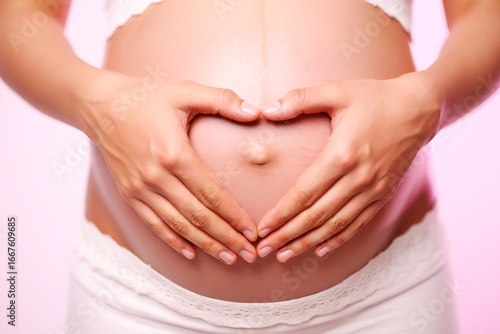 Wallpaper Mural Pregnant belly with heart shape hands image Torontodigital.ca