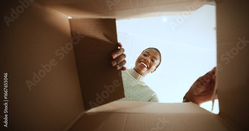 Fotografie Black woman, open box and smile with POV in home, low angle or ecommerce for product, order or delivery